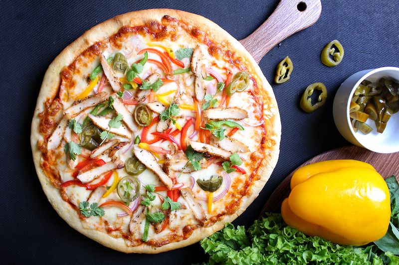 Spicy Diablo pizza with jalapeños and pepper sauce